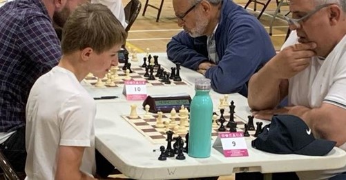 Joint winners of the Major U1900 section Alex Royle (left) & Ionel Dragan deep in thought during their round 4 encounter